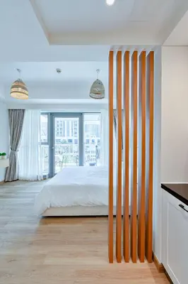a bedroom with a bed and a large window at Modern Studio I Boulevard View I Downtown Dubai in Dubai