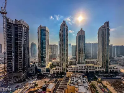 a group of tall buildings in a city at Amazing 1 Bedroom in Burj Royale Downtown in Dubai