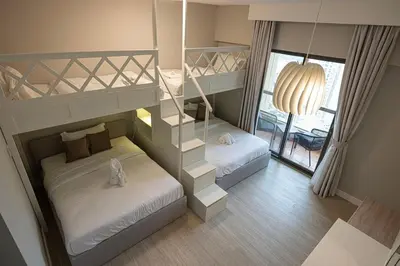 a bedroom with two bunk beds and a window at FIRST CLASS 2BR Breathtaking Beach Views in Dubai