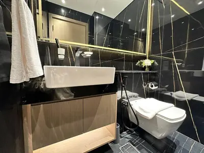 a bathroom with a sink and a toilet at Comfortable 1br In Jvc Balcony Free Parking in Dubai