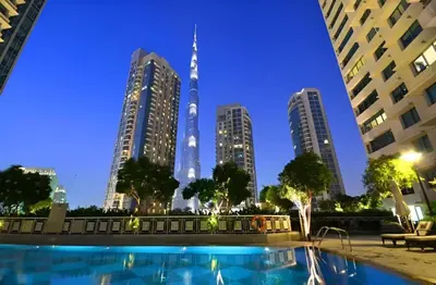 a view of the kuala lumpur city skyline at night at La Vista Holiday Home with burj khalifa & fountain view in Dubai