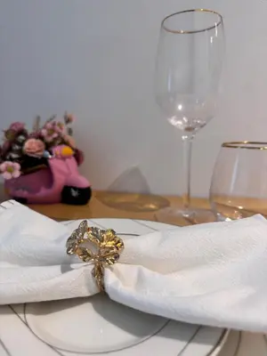 a table with a napkin and a glass of wine at Cozy Studio in Empire Residence in Dubai