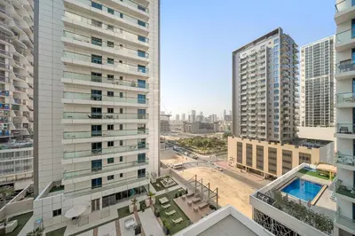 an aerial view of a city with tall buildings at Cozy Studio in Empire Residence in Dubai