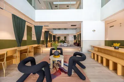 a lobby with black sculptures on the floor at Mood Living 22 in Dubai