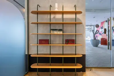 a shelf in a room with wooden shelves at Mood Living 22 in Dubai