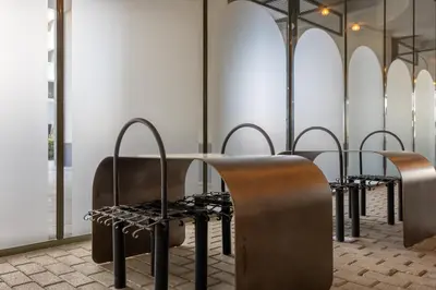 a row of tables and chairs in a room at Mood Living 22 in Dubai