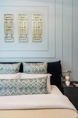 a bedroom with a bed with a picture above it at The Smart Concierge - Urban Oasis by Missoni in Dubai