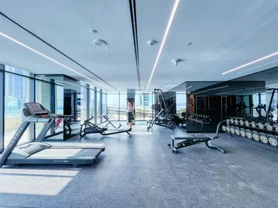 a gym with treadmills and machines in a building at The Smart Concierge - Urban Oasis by Missoni in Dubai