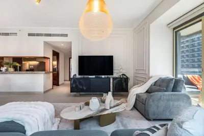 a living room with a couch and a tv at The Smart Concierge - Southridge 1 in Dubai