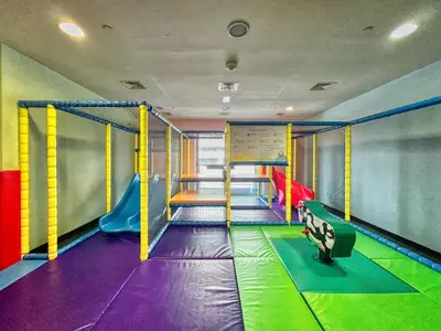a childrens play room with a trampoline at The Smart Concierge - Princess tower in Dubai