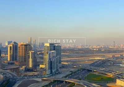 an overhead view of a city with a freeway at Sleek 2BR in Nobles, Business Bay in Dubai
