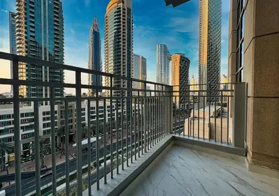 a balcony with a view of a city skyline at DreamShoma -2BR Deluxe Downtown Skyview in Dubai