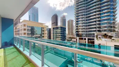 a balcony with a view of the city at Orra Tower - Stunning One Bed with Marina View in Dubai