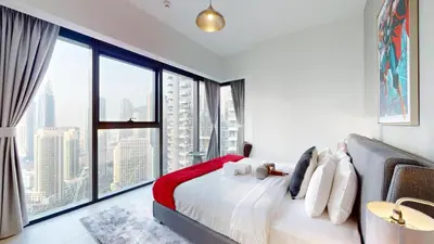 a bedroom with a bed with a large window at Vacationer l Marvel Super Hero Themed 3 Bedroom l Dubai Fountain Views in Downtown in Dubai
