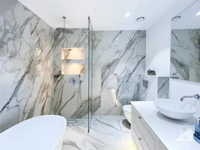 a white bathroom with a sink and a shower at Spacious 2B Apt with Full Marina Views - Delphine in Dubai