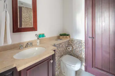 a bathroom with a sink and a toilet and a mirror at Frank Porter - Reehan 7 in Dubai