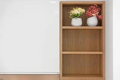 a book shelf with two vases with flowers on it at Amazing 2BR Home Burj Khalifa View Steps Walk to DubaiMall in Dubai