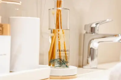 a glass vase filled with yellow toothbrushes on a bathroom counter at Amazing 2BR Home Burj Khalifa View Steps Walk to DubaiMall in Dubai