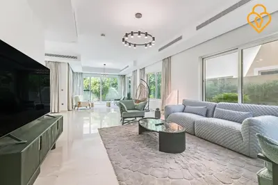 a living room with a couch and a table at keysplease 4 BR Villa private pool, Jumeirah Park in Dubai
