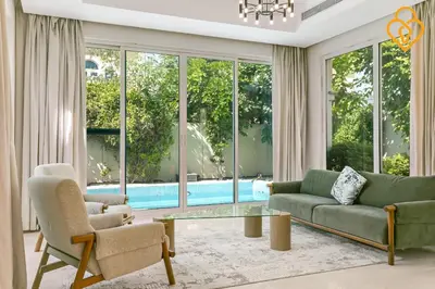 a living room with a couch and chairs and a pool at keysplease 4 BR Villa private pool, Jumeirah Park in Dubai