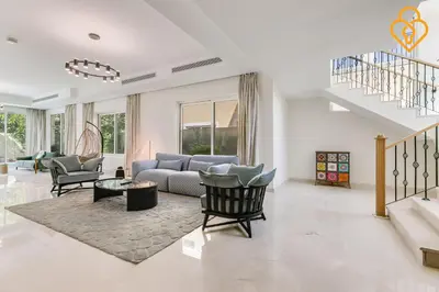 a living room with a blue couch and chairs at keysplease 4 BR Villa private pool, Jumeirah Park in Dubai