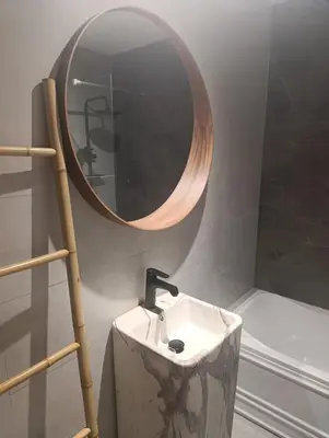 a bathroom with a sink and a mirror on the wall at In the heart of Dubai in Dubai