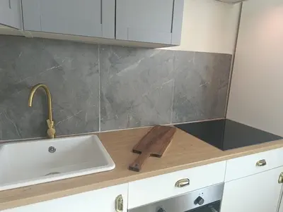 a kitchen with a sink and a counter top at In the heart of Dubai in Dubai