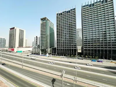 a highway in a large city with tall buildings at Step into Sophistication - Stylish 1-BR Apartment in Downtown Dubai by petals Holiday Homes in Dubai