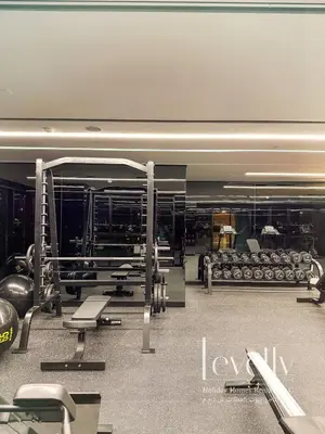 a gym with benches and weights in a building at Urban Oasis by Missoni Brand NEW Luxury in Dubai