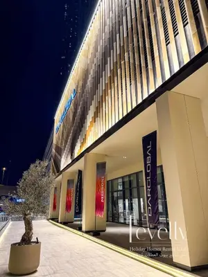 a building with a tree in front of it at Urban Oasis by Missoni Brand NEW Luxury in Dubai