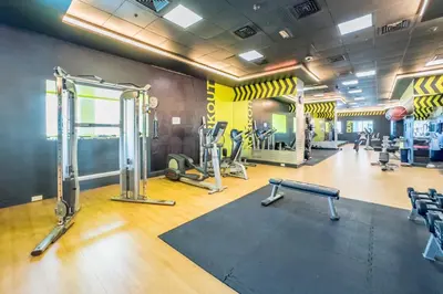 a gym with treadmills and machines in a room at Revamped 1BR Unit with Partial Sea & Palm Jumeirah Views Close to Beach , Elite Residence, Dubai Marina by Deluxe Holiday Homes in Dubai