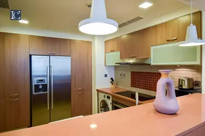 a purple vase sitting on a counter in a kitchen at Exclusive 2BR Home Marina Residence 4, The Palm in Dubai