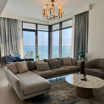 a living room with a couch and a table at THE COVE Creek Harbour in Dubai