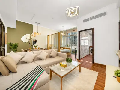 a living room with a couch and a table at Spacious High Floor Apartment Dubai Marina in Dubai