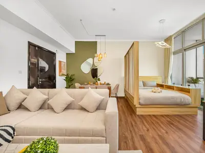 a living room with a couch and a table at Spacious High Floor Apartment Dubai Marina in Dubai