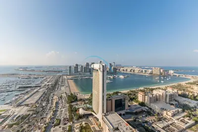 an aerial view of the city of dubai with at Upgraded 1BR Overlooking Palm Jumeirah & Sea Views from Living to Bedroom, Elite Residence, Dubai Marina by Deluxe Holiday Homes in Dubai