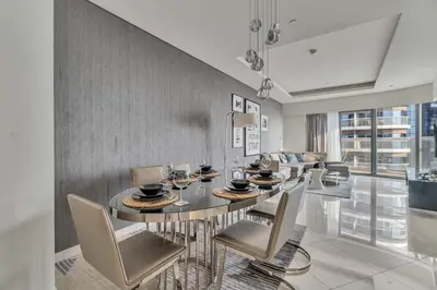 a dining room with a table and chairs at GuestReady - Luxurious interiors in Business Bay in Dubai