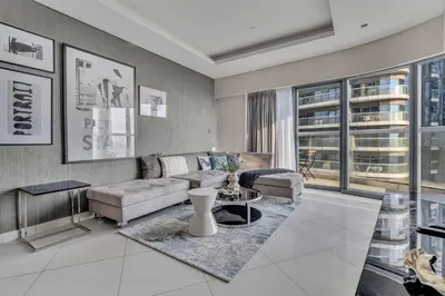a living room with a couch and a table at GuestReady - Luxurious interiors in Business Bay in Dubai