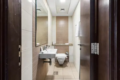 a bathroom with a sink and a toilet at 1BR Botanica Dubai Marina in Dubai