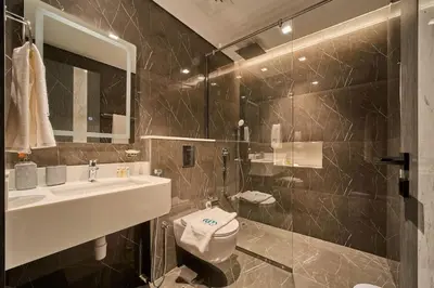 a bathroom with a sink and a toilet at FAM Living - Samana Park Views - Brandnew 1Bed in Dubai