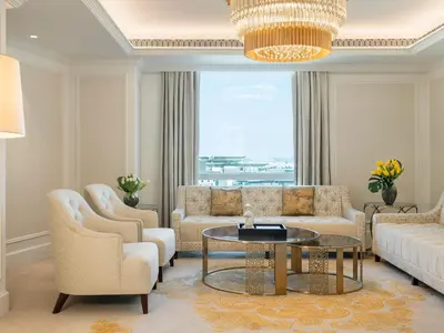 a living room with a couch and chairs and a table at Cheval Maison - Expo City Dubai in Dubai