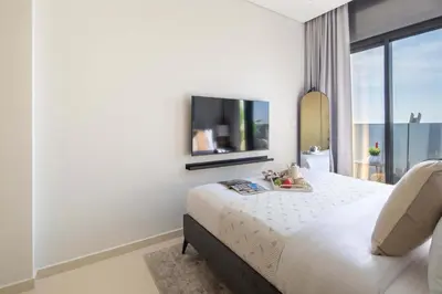 a hotel room with a bed and a tv at Frank Porter - Aykon City Tower C in Dubai