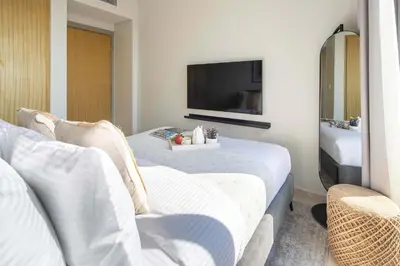a hotel room with a bed and a tv at Frank Porter - Aykon City Tower C in Dubai