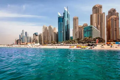 a view of a beach in front of a city at Cozy 1bd near JBR Beach in Dubai