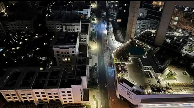 an aerial view of a city at night at Attraction Partition Room in Barsha heights Tecom in Dubai