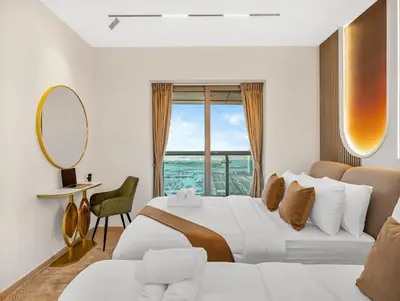 a hotel room with two beds and a mirror at SKY HIGH 2 BHK # Ain Dubai & Sea View # Marina & JBR in Dubai