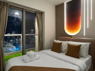 a hotel room with two beds and a large window at SKY HIGH 2 BHK # Ain Dubai & Sea View # Marina & JBR in Dubai