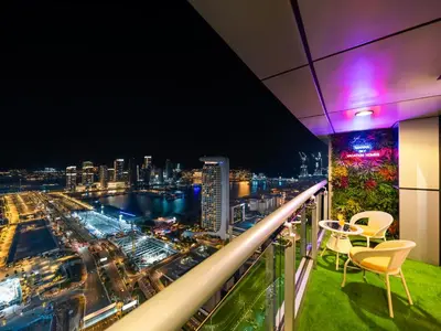 a balcony with a view of a city at night at SKY HIGH 2 BHK # Ain Dubai & Sea View # Marina & JBR in Dubai