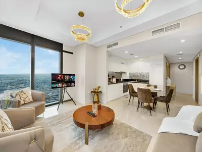 a living room with a couch and a table at Lux Apartments in BusinessBay, Canal views, Great Location in Dubai