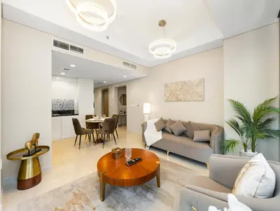 a living room with a couch and a table at Lux Apartments in BusinessBay, Canal views, Great Location in Dubai